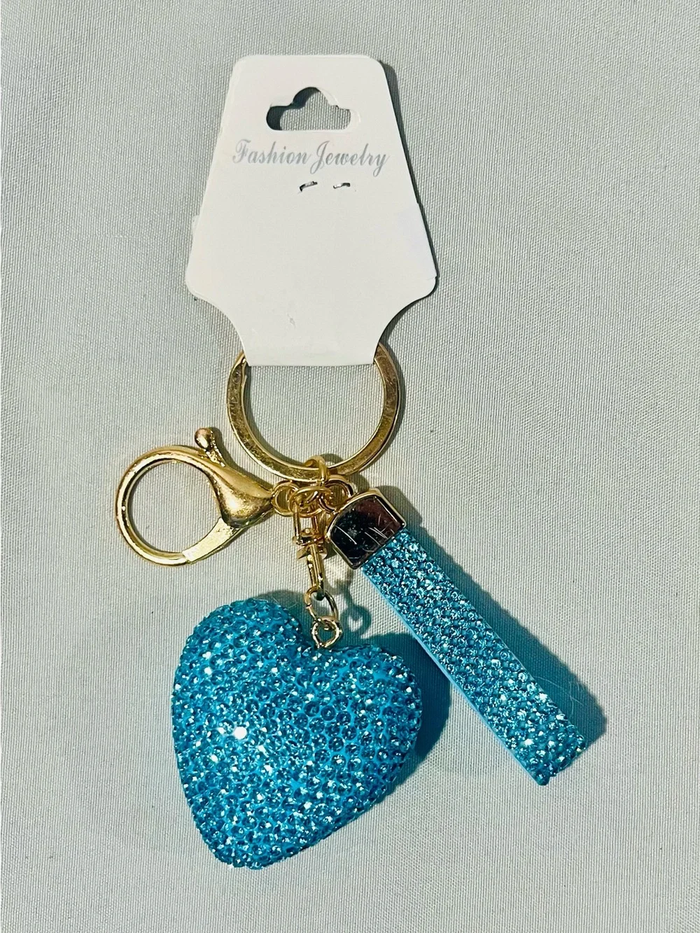 Fashion Jewelry Gold Keyring with Blue Crystal Heart and Strap